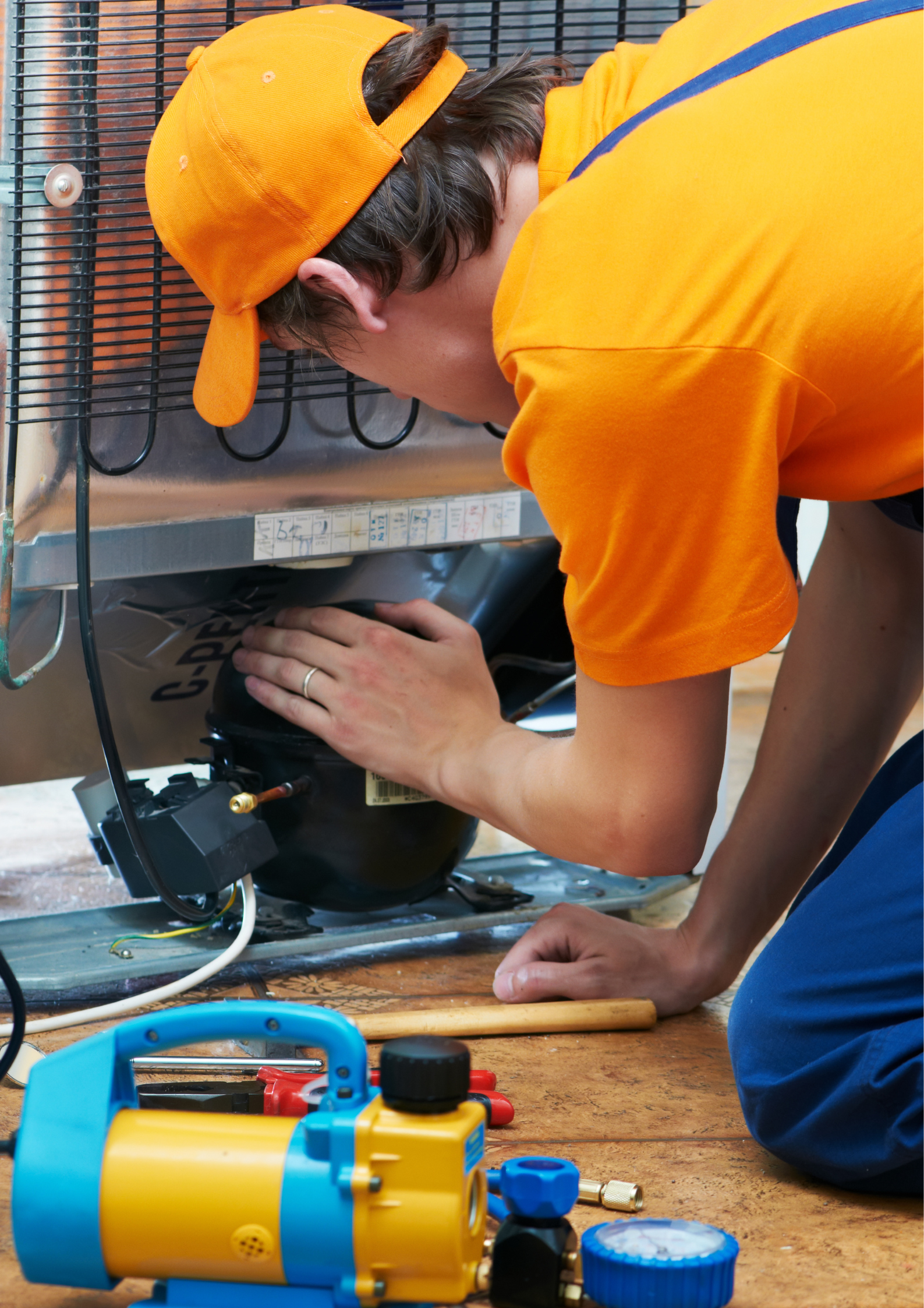 Electrician repairing an appliance electrical control panel in Durban