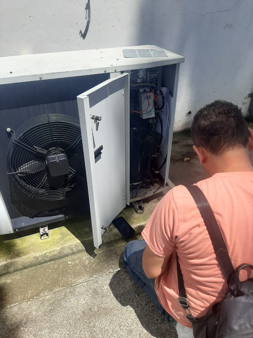 Professional fridge repair technician diagnosing appliance issues in Durban